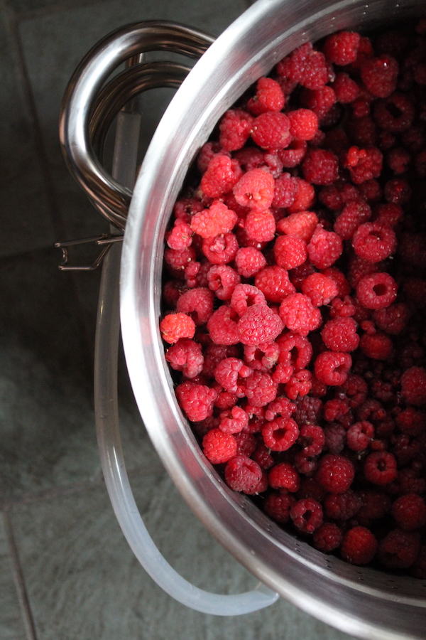 Raspberries in a steam juicer