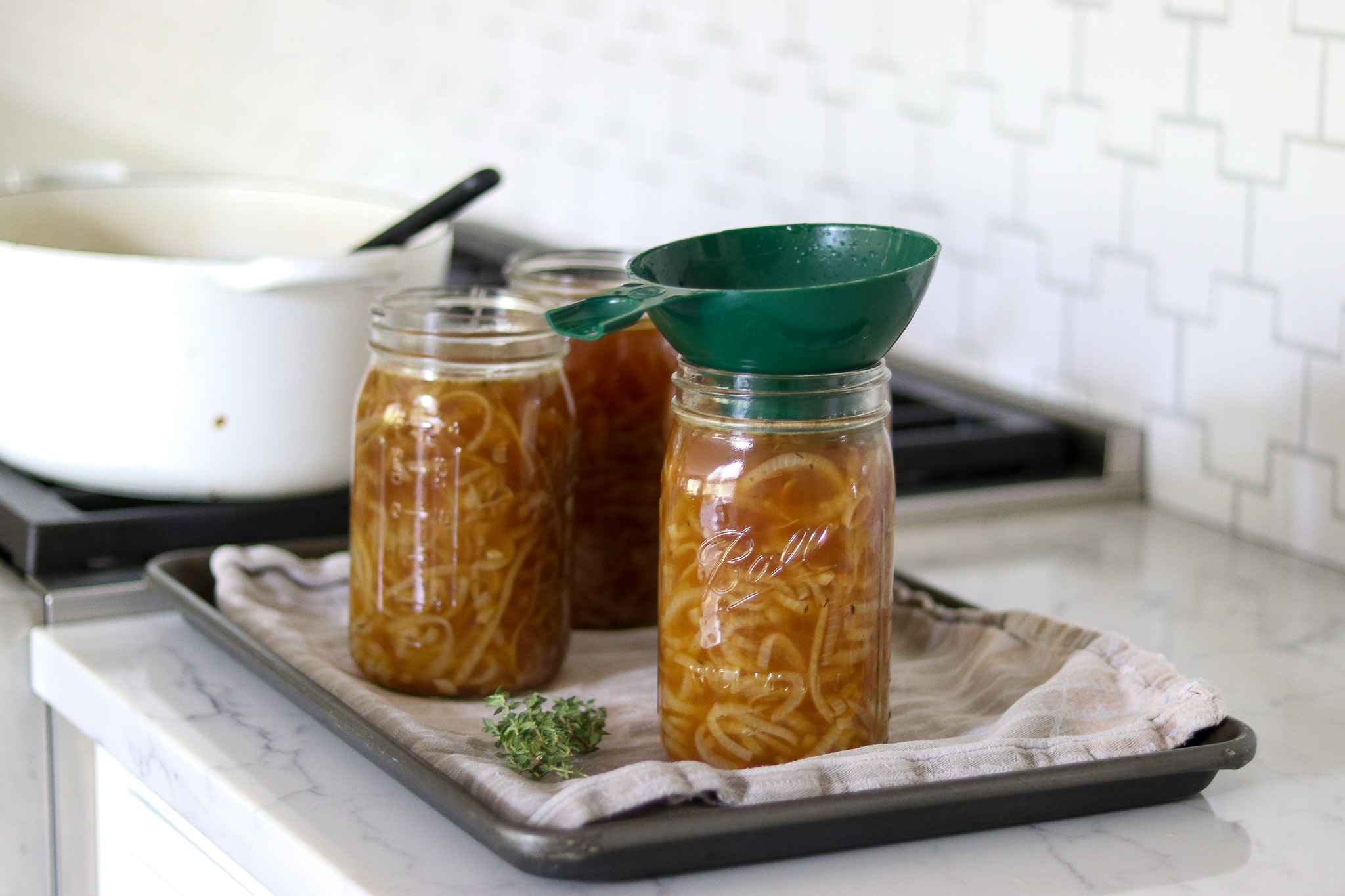Filling Jars with French Onion Soup