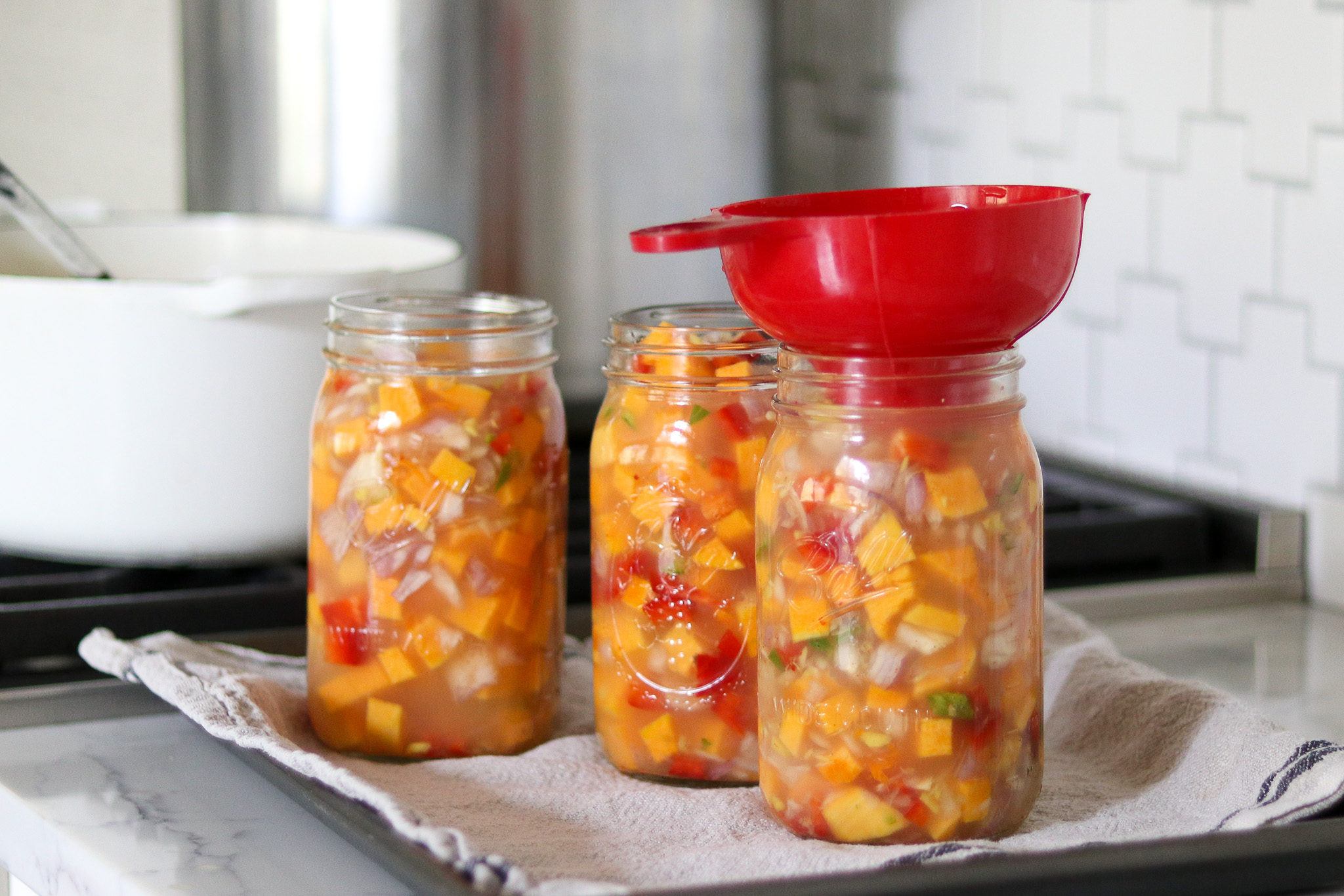 Packing Jars of Thai Squash Soup for Canning