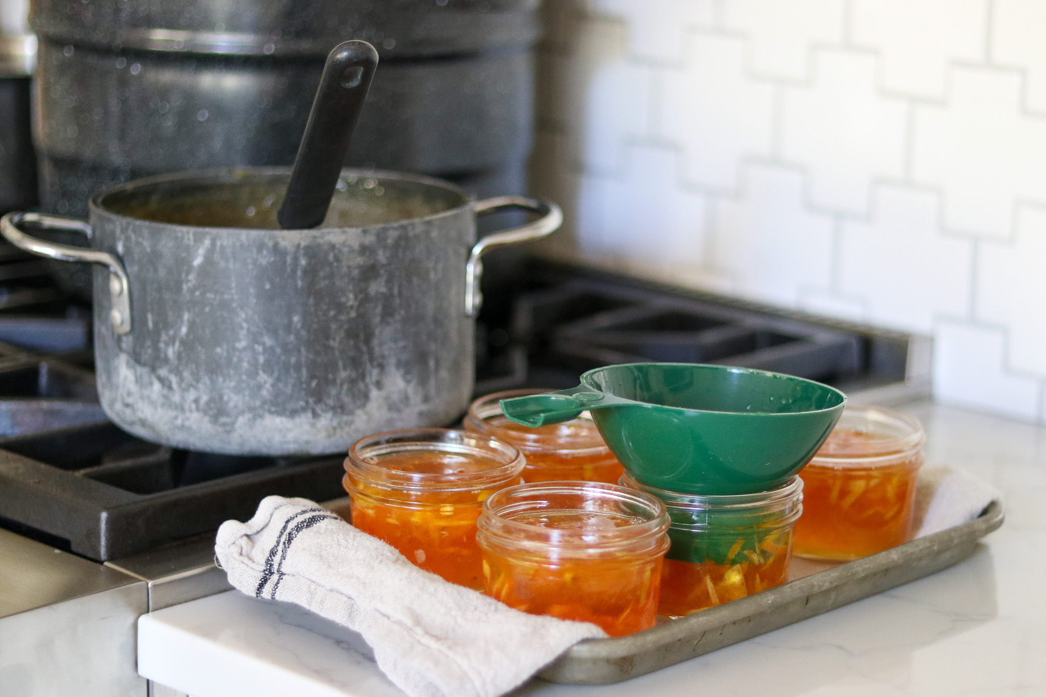 Kumquat Marmalade Ladle into Jars