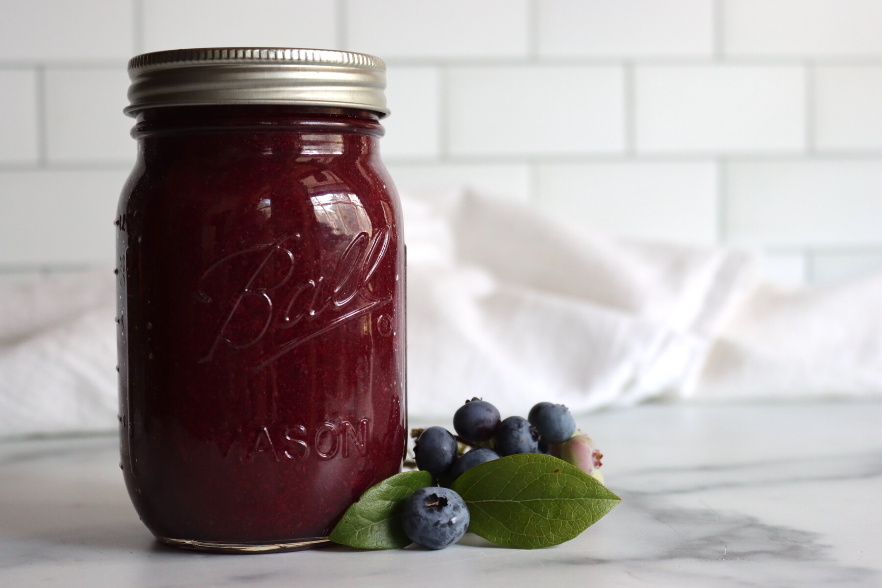 Blueberry applesauce cooking down in a pot