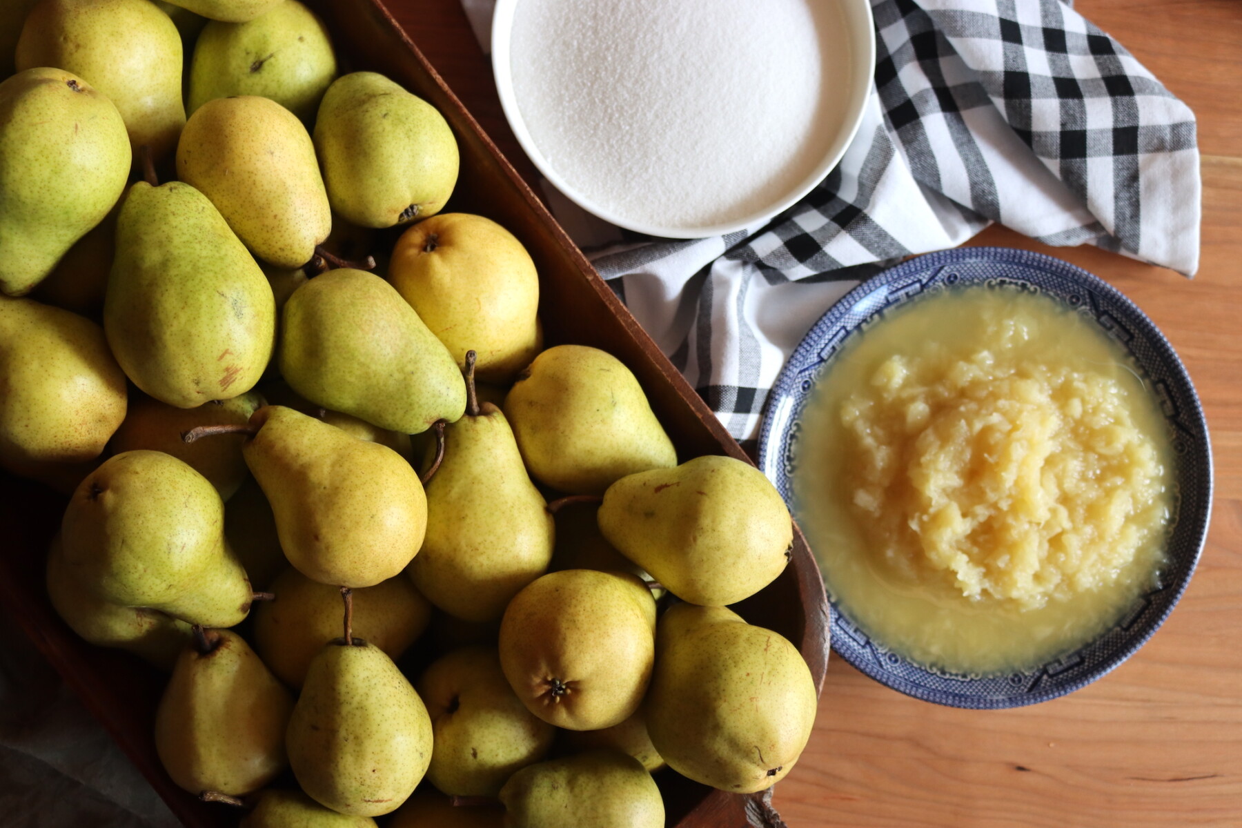 Fresh pears, sugar, and crushed pineapple ready for making pear honey