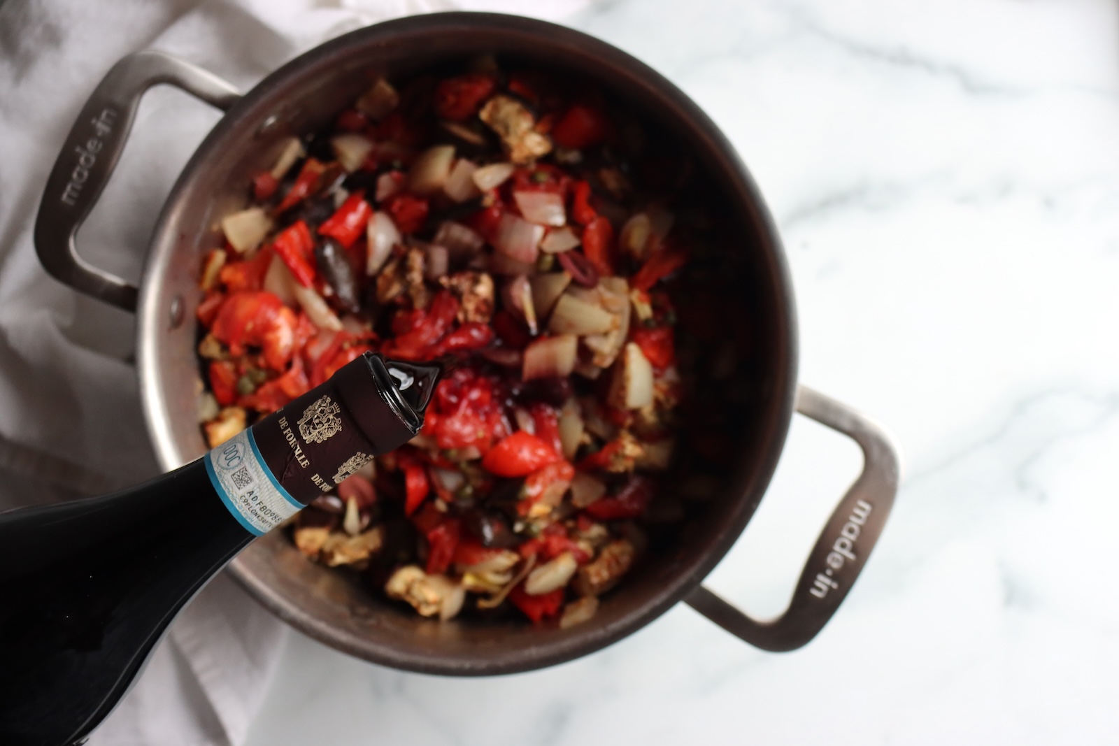 Adding wine to eggplant puttanesca