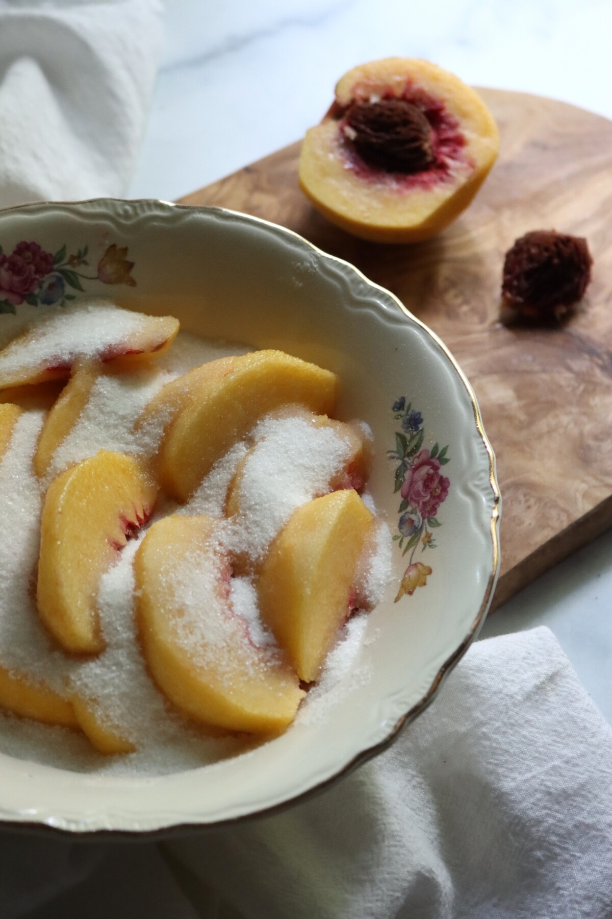 Sliced peaches in sugar for peach preserves