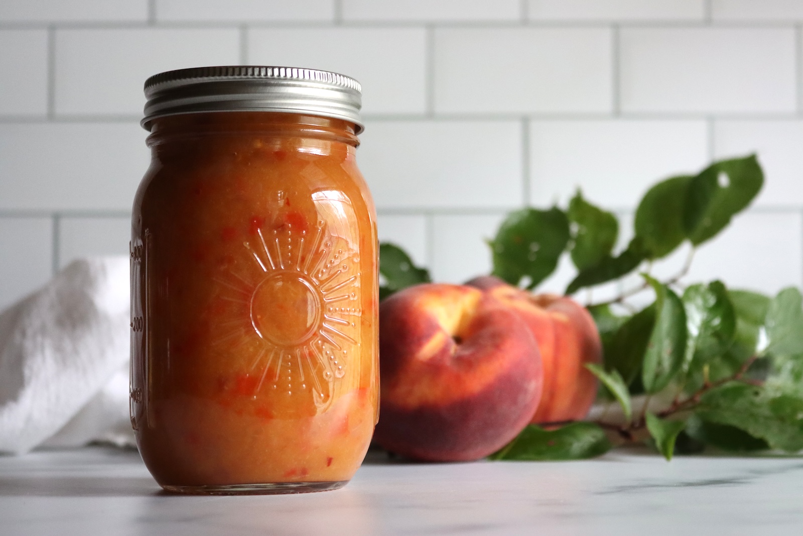 Peach BBQ Sauce in a pint jar