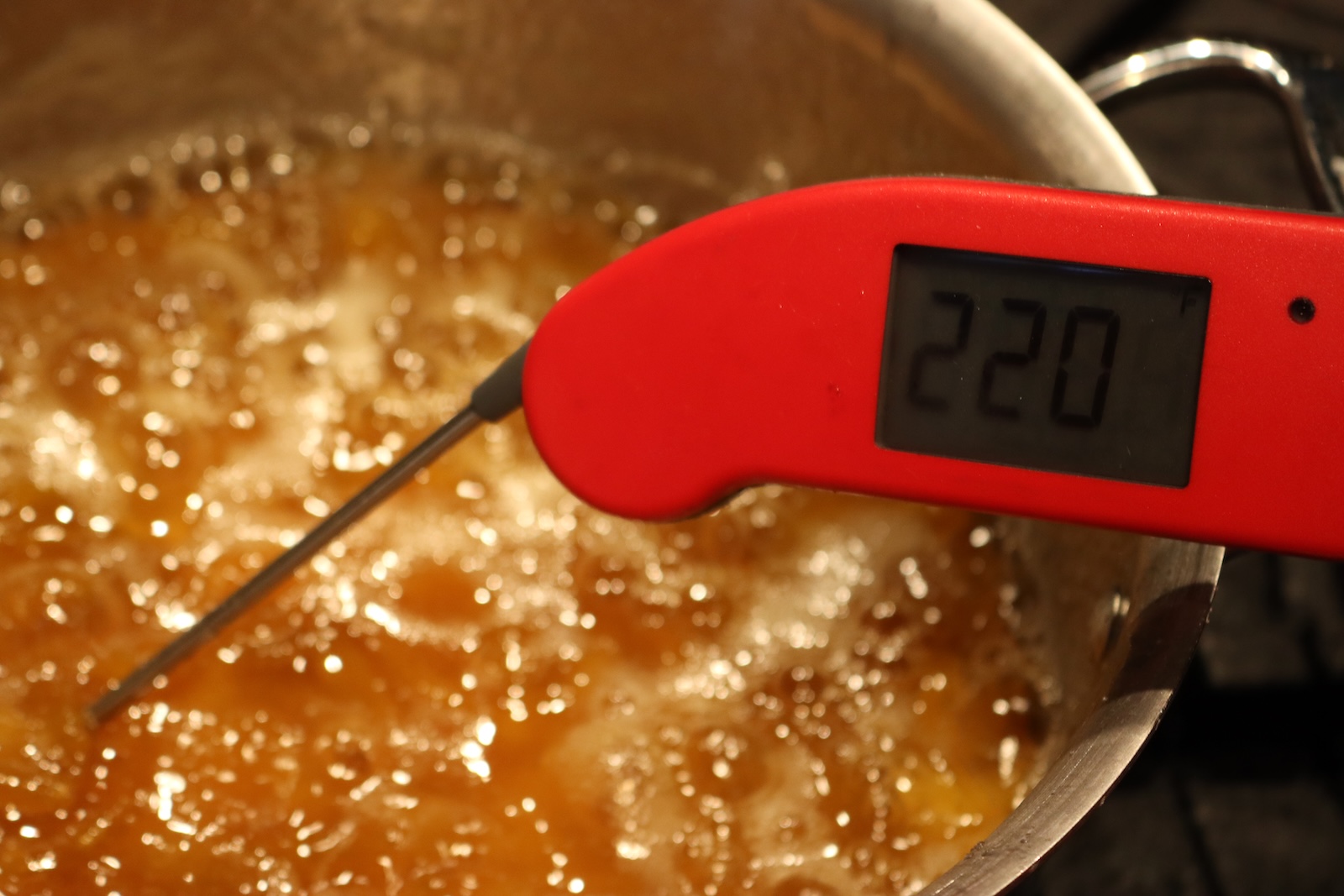 Thermometer reading 220 degrees F in boiling mirabelle plum jam