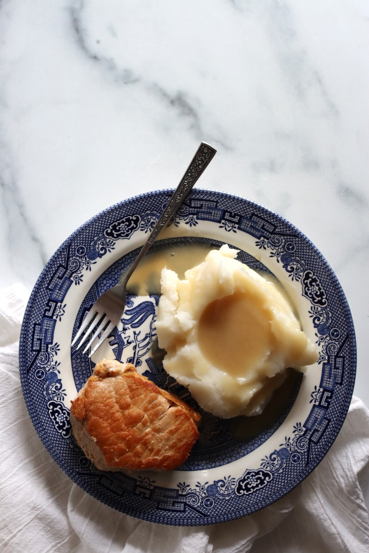 Canned pork chop dinner with mashed potatoes and gravy made from the juices in the jar
